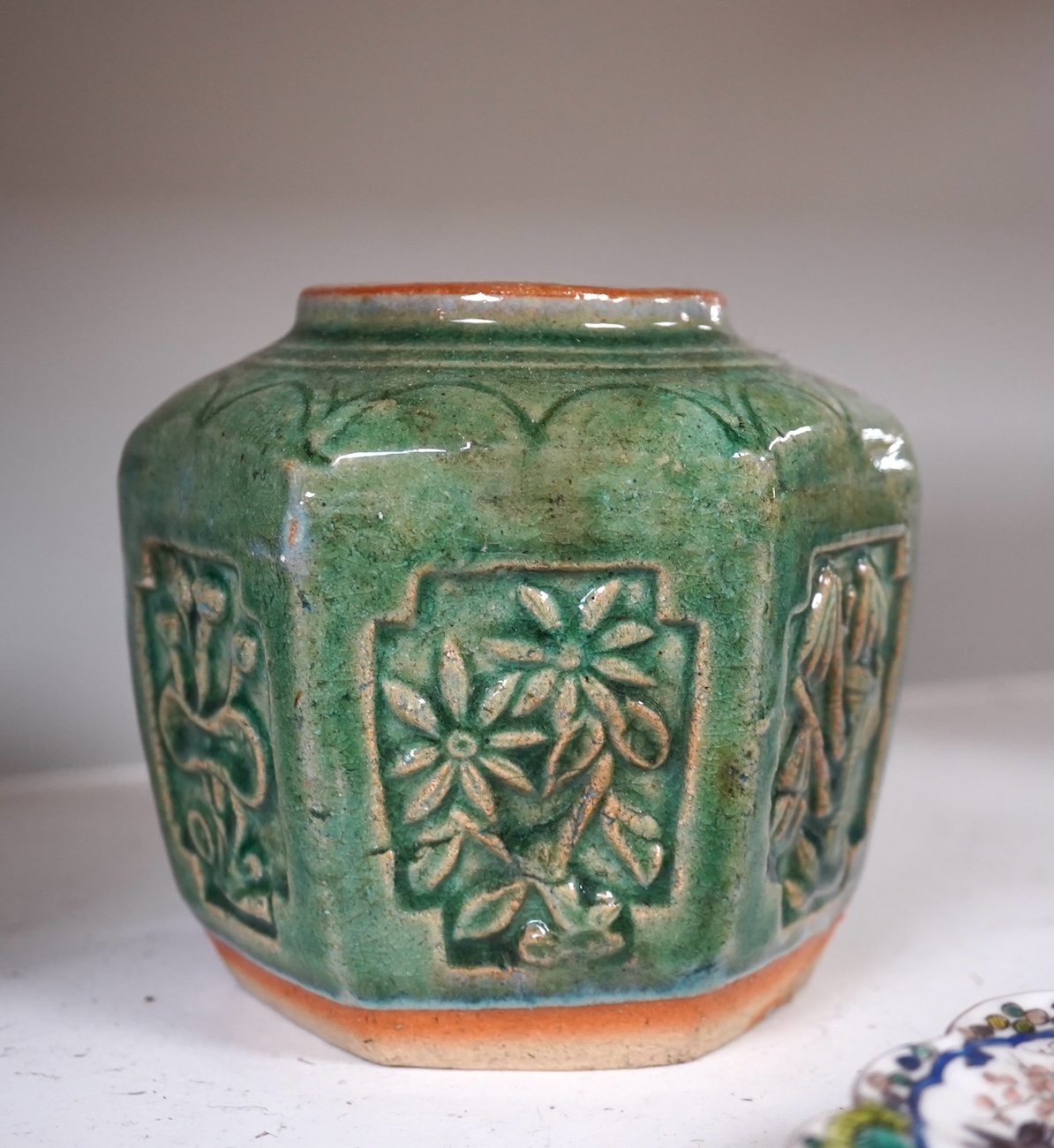 A 19th century Chinese blue and white 'prunus' vase, a Chinese green glazed jar, a Japanese vase and two dishes and two Canton famille rose plates (7). Condition - fair to good